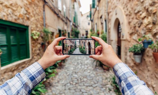 photos showing a person with a smarphone on what we believe to be protective glass that uses silicones in the adhesive to maintain sensitivity at its best performance